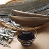 昆布をかつお節と煮干の出汁、醤油等で炊き詰めた、神宗オリジナルの煮汁です